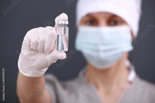 A doctor or scientist in laboratory holding a liquid vaccines for children or older adults, or cure animal diseases. Concept:diseases,medical care,science, anesthesia,euthanasia,diabetes.