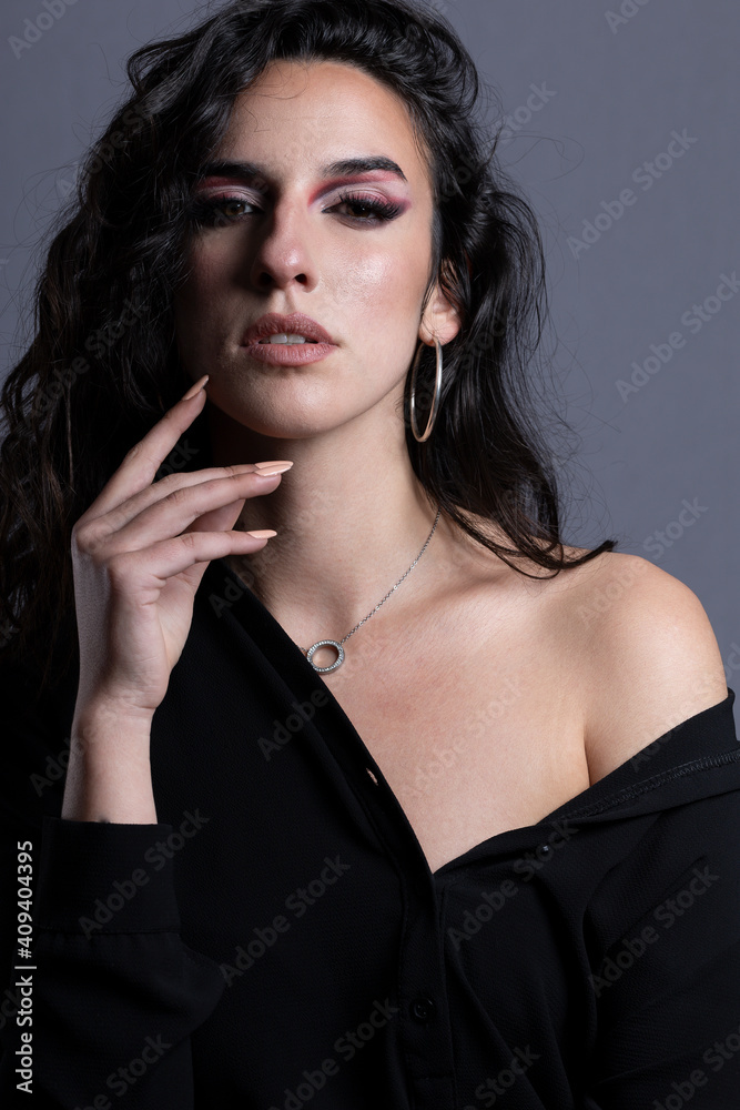 Obraz premium portraits of beautiful woman with black hair on gray background