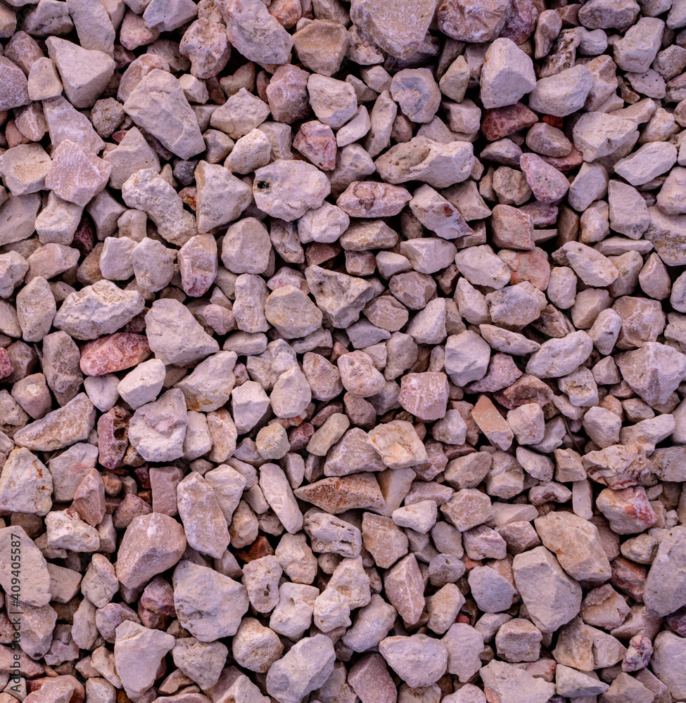 Stone background. blue gravel. Granite texture. The rocky road. Construction material. The texture of the stones. Wallpaper with fine gravel. Stone background. blue gravel. Granite texture. The rocky road. Construction material. The texture of the stones. Wallpaper with fine gravel.