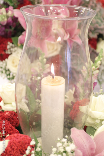 candle of condolence with flowers