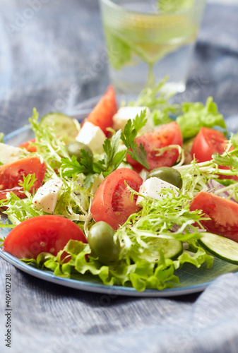 Salad with Green Olives, Tomatoes and Feta Cheese. Bright background. 