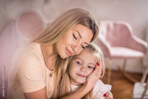 Mother and daughter in hug. 
