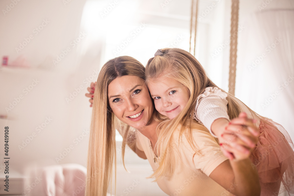 Mother and daughter playing together. Mother and daughter playing together.