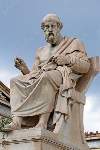 the marble statue of the ancient Greek philosopher Plato in front of National Academy of Athens. Cloudy day
