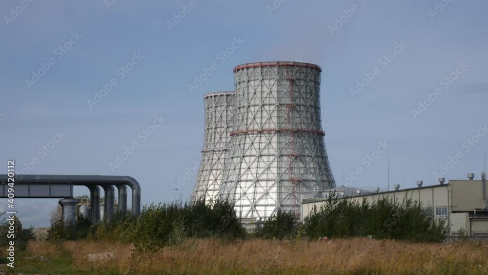 Cooling towers of CHP or thermoelectric power station. Concept of ecology, environmental protection. Cooling towers of CHP or thermoelectric power station. Concept of ecology, environmental protection.
