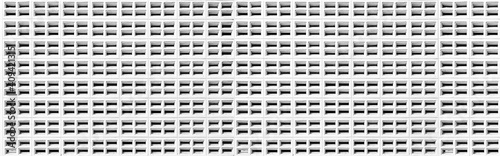 Panorama of White vented cement block pattern and background seamless