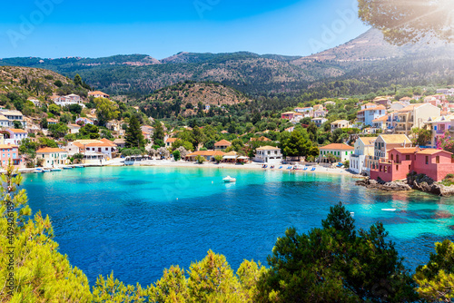 The little village of Assos on the Ionian island of Kefalonia, Greece, with turquoise sea and green hills, famous tourist attraction and sailors marina