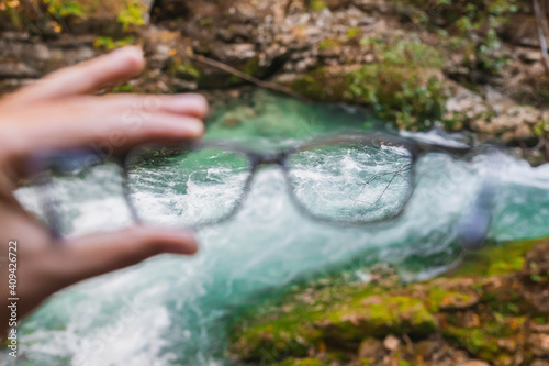 seething mountain river in Slovenia through glasses photo