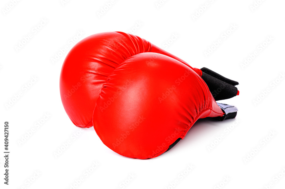 a pair of red karate gloves on a white isolated background