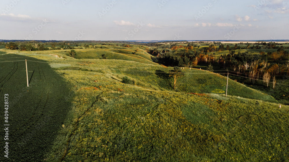 Naklejka premium Nice view of the ravine and hills from the drone at sunset.