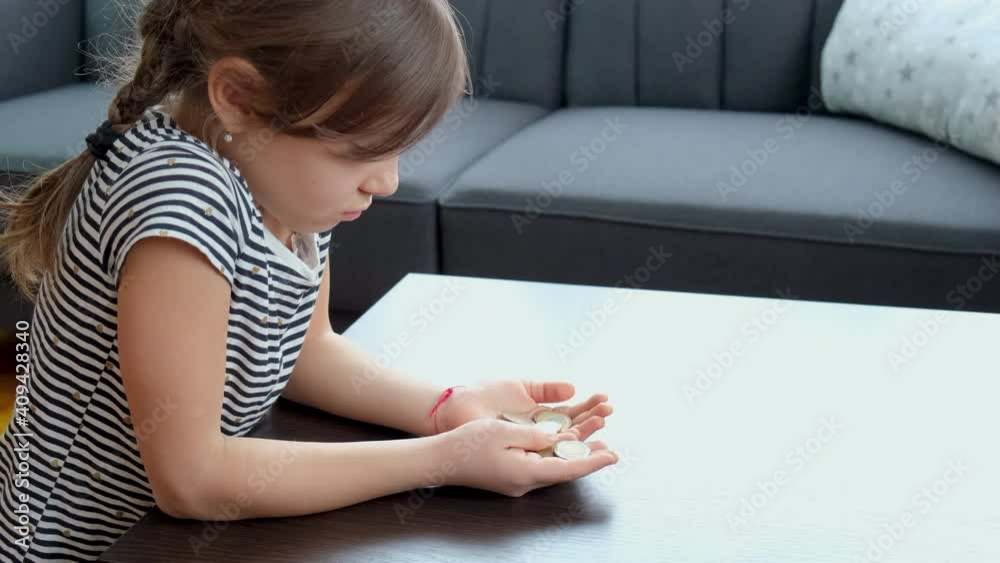 child girl counts small money. selective focus. child girl counts small money. selective focus.