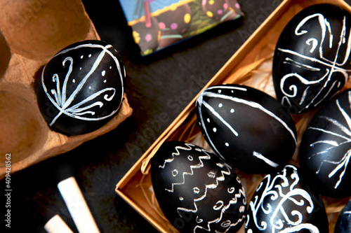 Easter eggs painted with chalk paint. Painted black easter egg photo