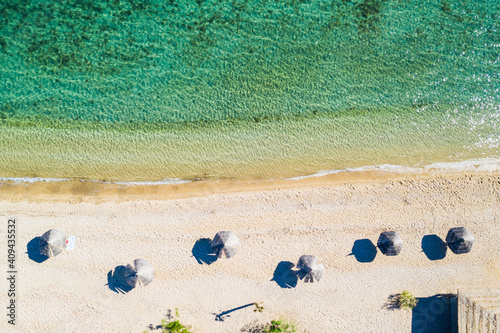 Beautiful sand beach wit parasols. Overhead aerial view. Adriatic sea in Croatia on Pag island.