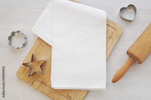 Blank white waffle kitchen towel mockup, flat lay with kitchen cloth, baking utensils.