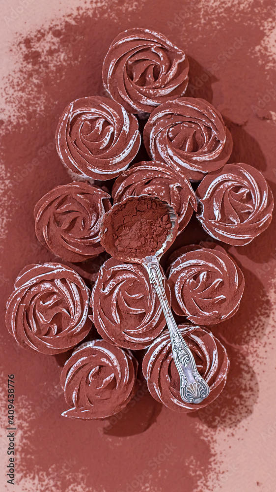 Delicate zephyr sprinkled with cocoa powder. Low-calorie marshmallows. Homemade dessert. Delicate zephyr sprinkled with cocoa powder. Low-calorie marshmallows. Homemade dessert.