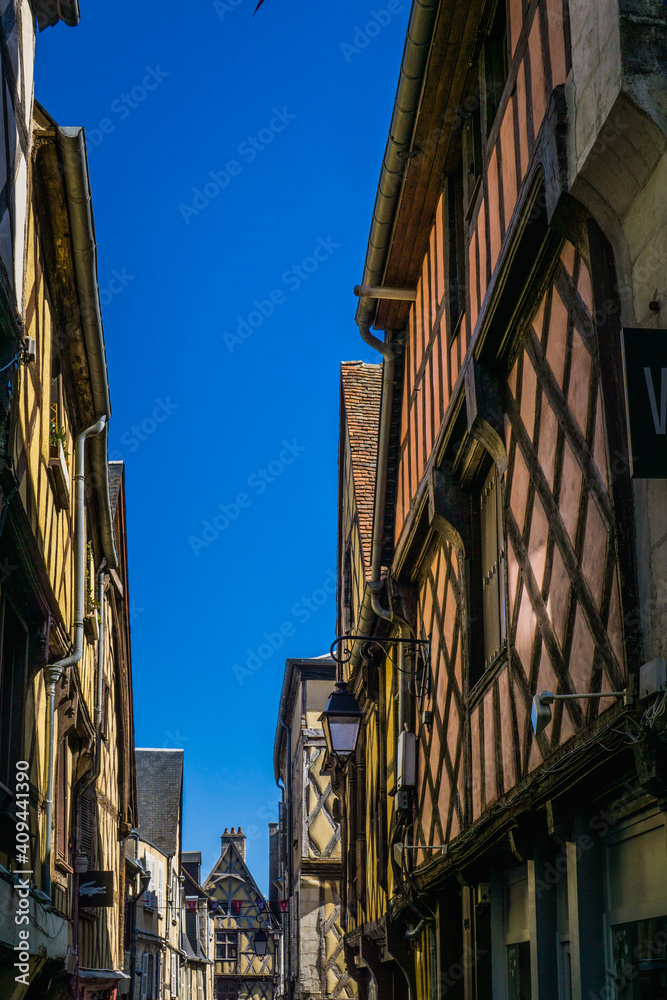 Medieval street with half timbered houses in the historical center of Bourges, a city located in the Berry region of France
