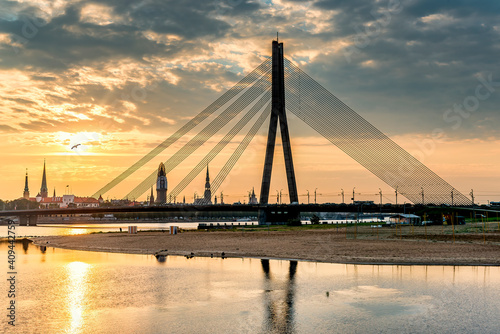 View on cable bridge and historical district of o Riga - the capital of Latvia and famous Baltic city widely known among tourists due to its unique medieval and Gothic architecture
