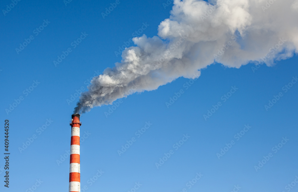 White thick smoke from the boiler room chimney. Industrial zone. White thick smoke from the boiler room chimney. Industrial zone.