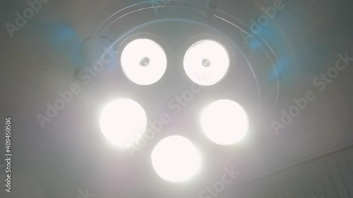 Surgical lamp in the operating room. Close-up. The surgical light turns on.