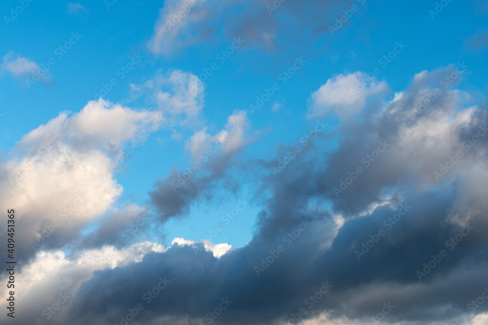Backgrounds and textures. Blue beautiful sky with clouds. Backgrounds and textures. Blue beautiful sky with clouds.
