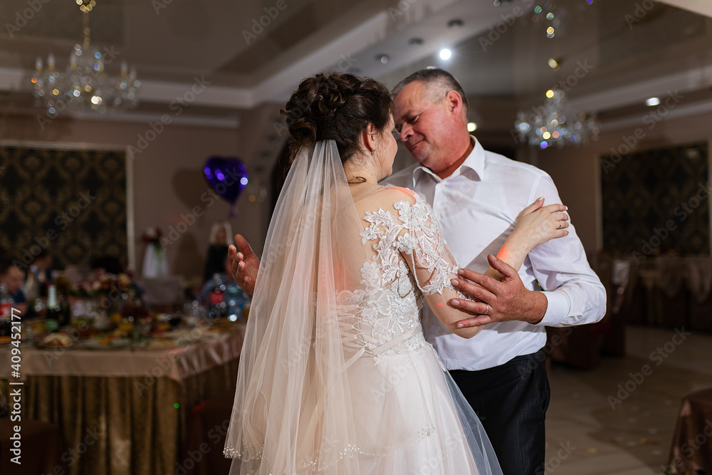 just got married, two lovers dance a slow dance at a wedding, a romantic celebration in a restaurant in elegant suits just got married, two lovers dance a slow dance at a wedding, a romantic celebration in a restaurant in elegant suits
