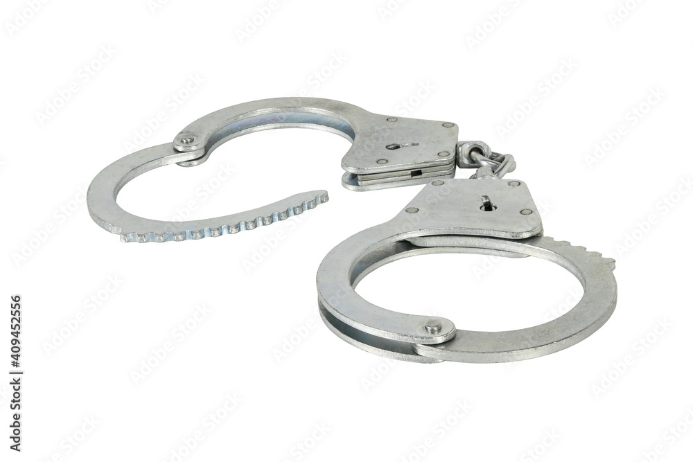 Handcuffs with one open isolated on white background without shadows. Pair of silver handcuffs macro close-up high resolution. Handcuffs with one open isolated on white background without shadows. Pair of silver handcuffs macro close-up high resolution.