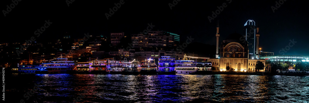 View of Istanbul at night from a cruise along the Bosphorus and Golden Horn, Turkey