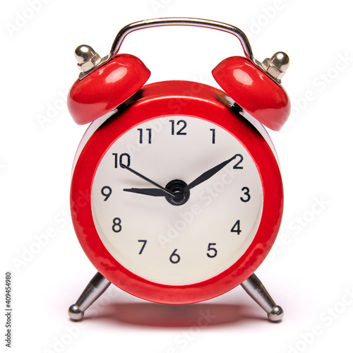 Red vintage alarm clock isolated on white background with clipping path