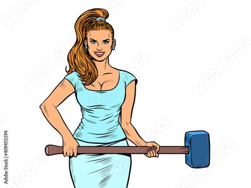 Beautiful strong woman with a hammer. Feminism