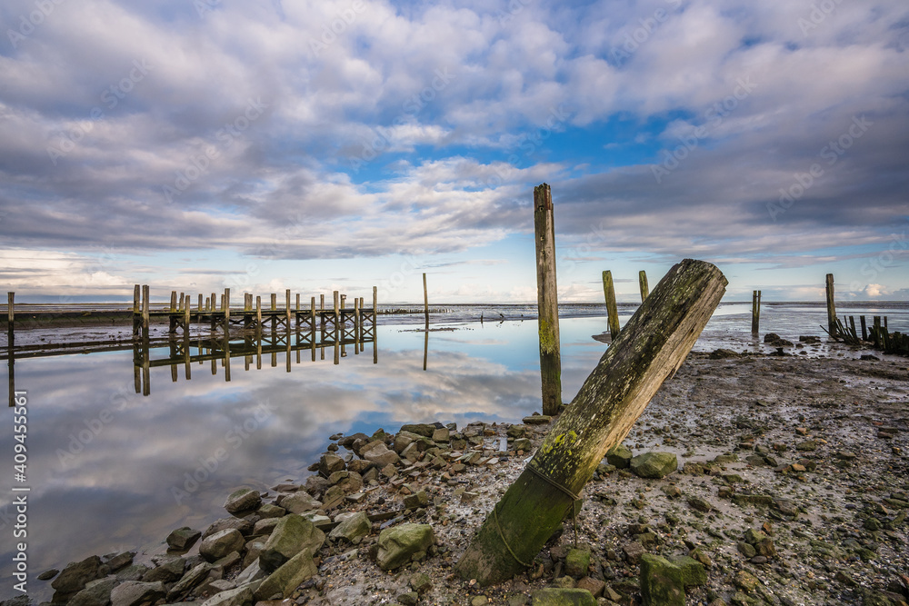 Small jetty with harbor along the coastline of the wadden island of Texel Small jetty with harbor along the coastline of the wadden island of Texel