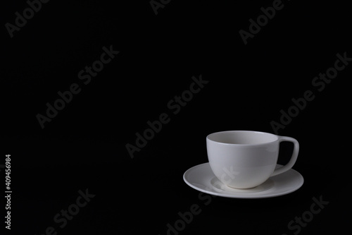 White coffee mug on black background