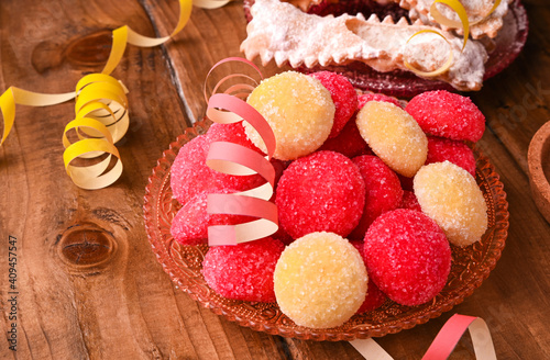 Baked castagnole. Traditional sweet pastries during the carnival period in italy. Street food, round biscuits with sugar for the carnival of Venice. Copy space.  photo