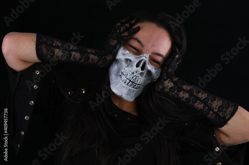 portrait of a girl in a monster mask on a black background