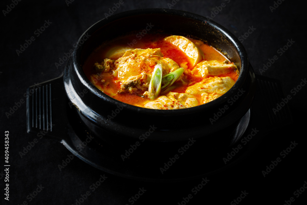 Korean spicy silken tofu stew with seafood Stock Photo | Adobe Stock