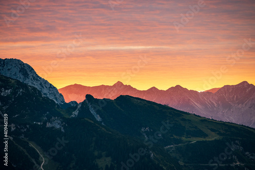 Strong alp glow before sunset in the alps looks like the mountains are on fire © Asvolas