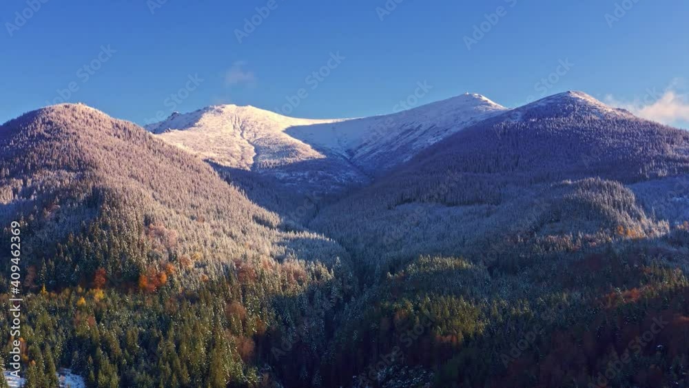 Picturesque mountain landscapes of autumn with snow near the village of Dzembronya in Ukraine Carpathians mountains. Aerial UHD 4K drone realtime video, shot in 10bit HLG and colorized Picturesque mountain landscapes of autumn with snow near the village of Dzembronya in Ukraine Carpathians mountains. Aerial UHD 4K drone realtime video, shot in 10bit HLG and colorized
