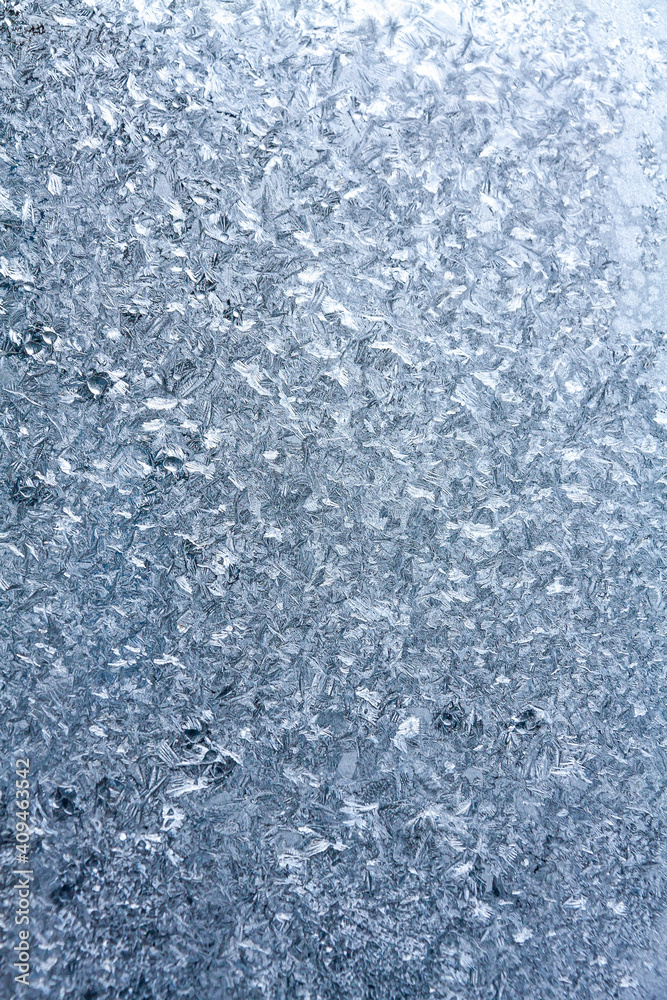 a winter window covered by frost