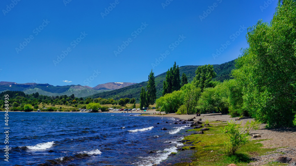 Lake Lolog landscape on a summer warm afternoon under a blue sky. San Martin de los Andes, Neuquen, Argentina            