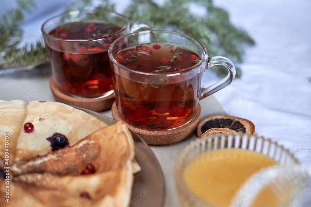 tea with pancakes and honey on the table tea with pancakes and honey on the table