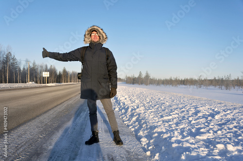 Hitchhiking on the winter road in Russia