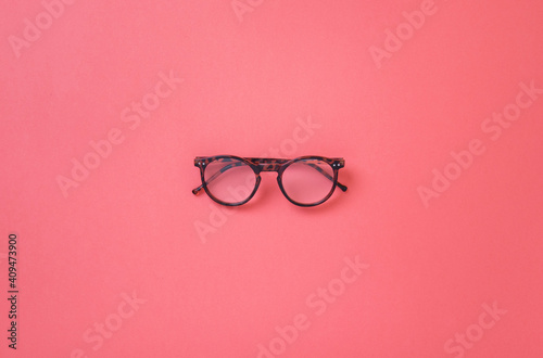 Leopard glasses on plain color background, reading and study glasses