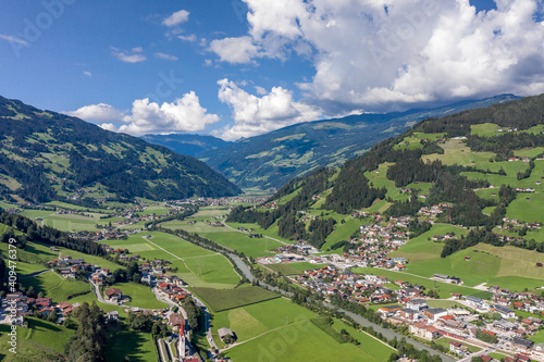Aerial drone shot of Zillertal valley with clouds in Tyrol Austria summer photo