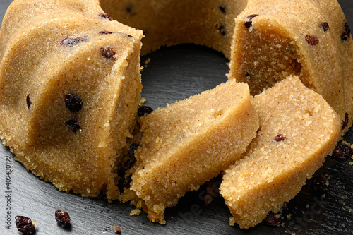 Homemade semolina halva with raisins served on black dish