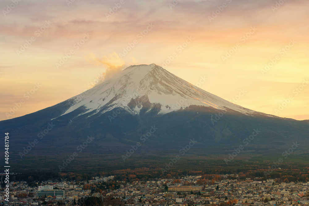 Close up top of beautiful Fuji mountain with snow cover on the top with could, Beautiful scenic landscape of mountain Fuji or Fujisan on during sunset, Japan
