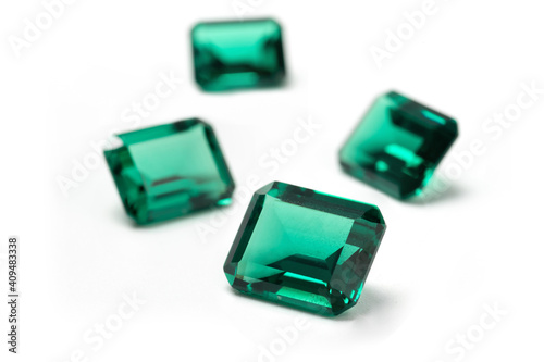 raw emeralds  gemstone jewelry isolated on white background