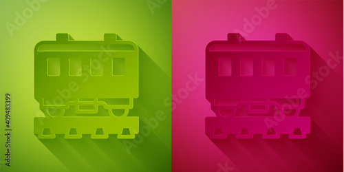 Paper cut Passenger train cars icon isolated on green and pink background. Railway carriage. Paper art style. Vector.
