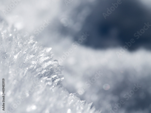 Abstract white and blue background of frozen snowflakes