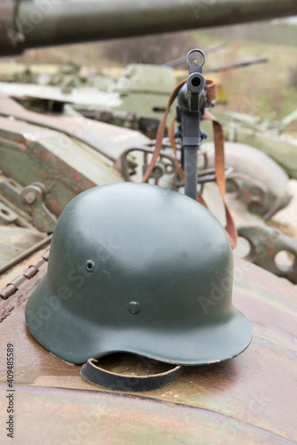 German helmet andr submachine gun on the armor of the tank