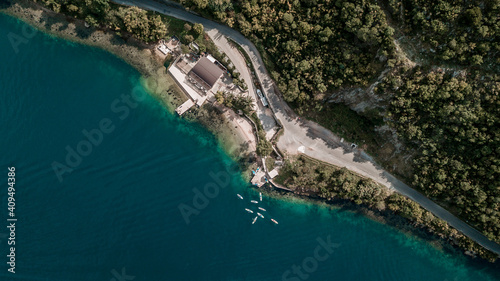 Aerial view of group of people with SUP Stand up paddle boards in blue water of Kotor bay (Boka Kotorska), Montenegro, Europe