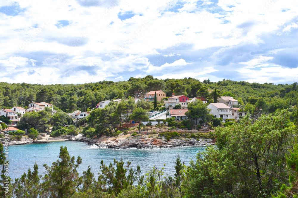 Beautiful Adriatic sea in Croatia, Hvar, small village,blue lagoon, coast, green pines, trees in summer. Mudri Dolac, Basina bay. Mudri Dolac, Basina bay